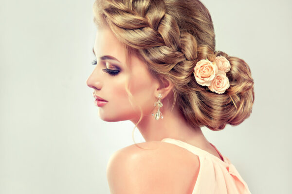 Beautiful model girl with elegant hairstyle . Beautiy woman with fashion wedding hair and colourful makeup